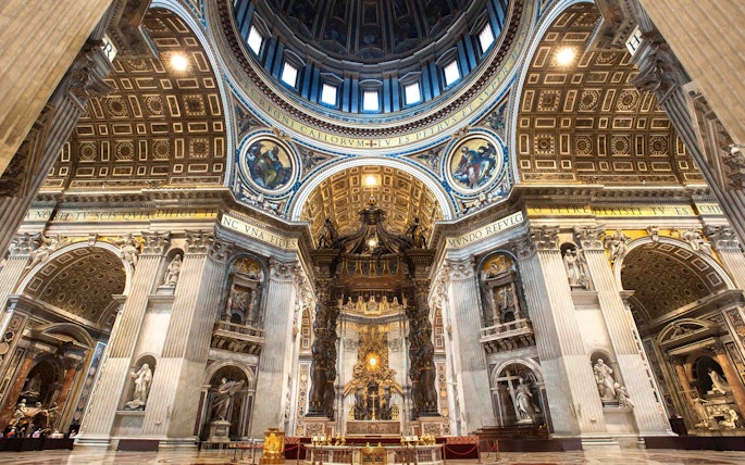 St. Peter's Basilica interior with ornate dome and altar in Vatican City.