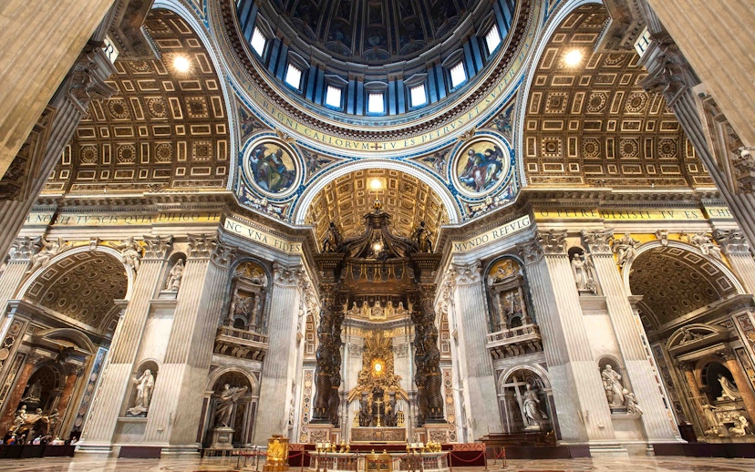 St. Peter's Basilica interior with ornate dome and altar in Vatican City.