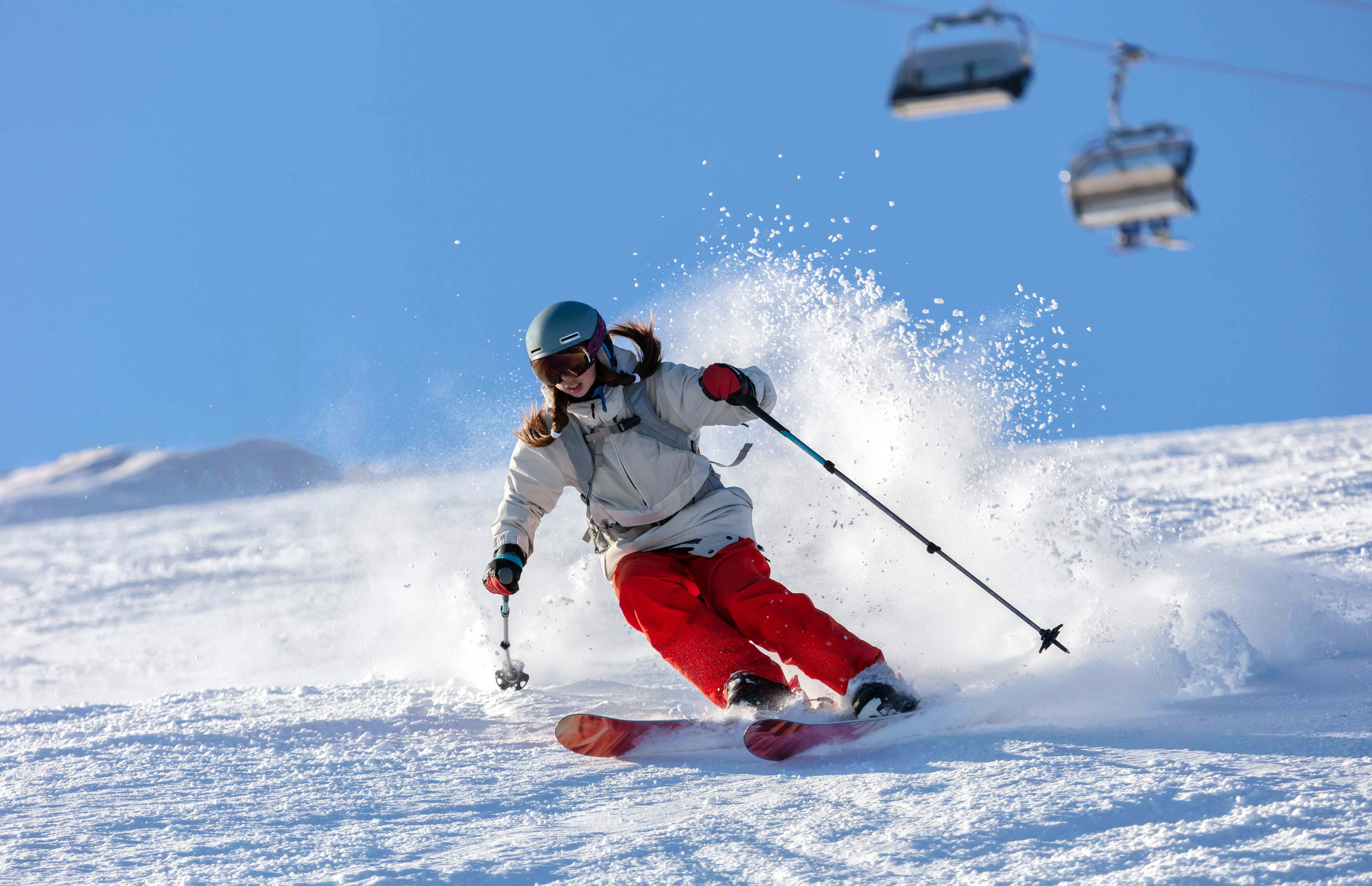 Skier descending snowy mountain in Athens during Christmas.