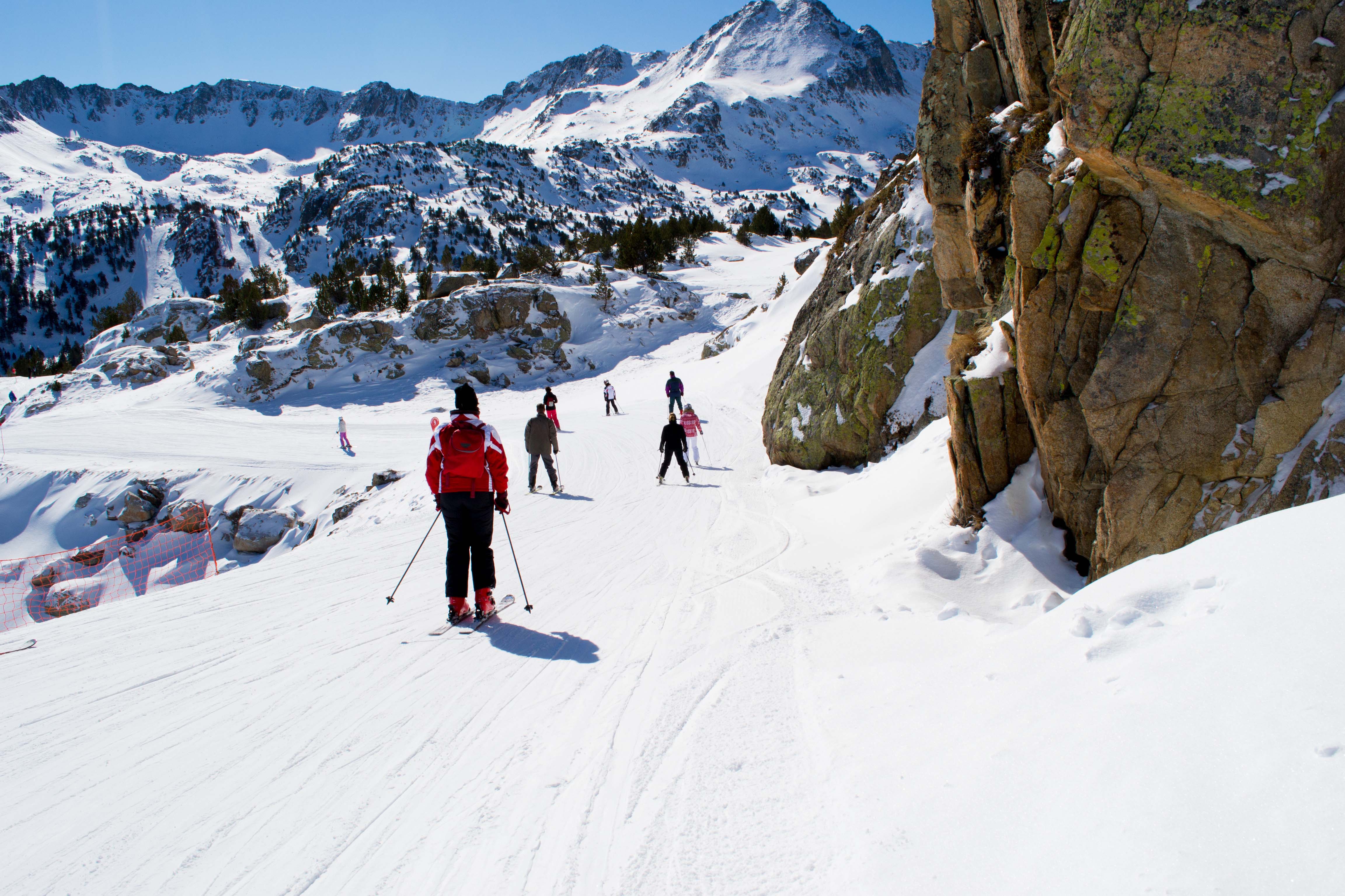 Skiers on a snowy slope in the Pyrenees, Andorra, near Barcelona.