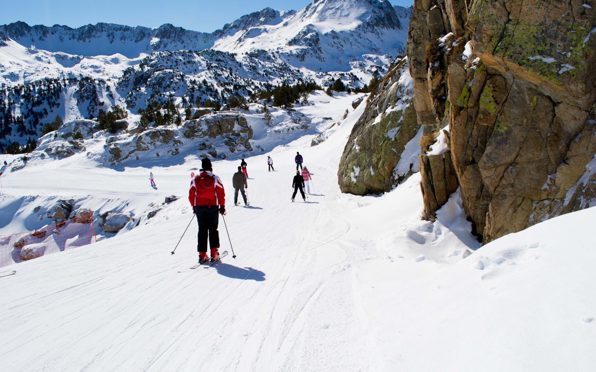 Skiers on a snowy slope in the Pyrenees, Andorra, near Barcelona.