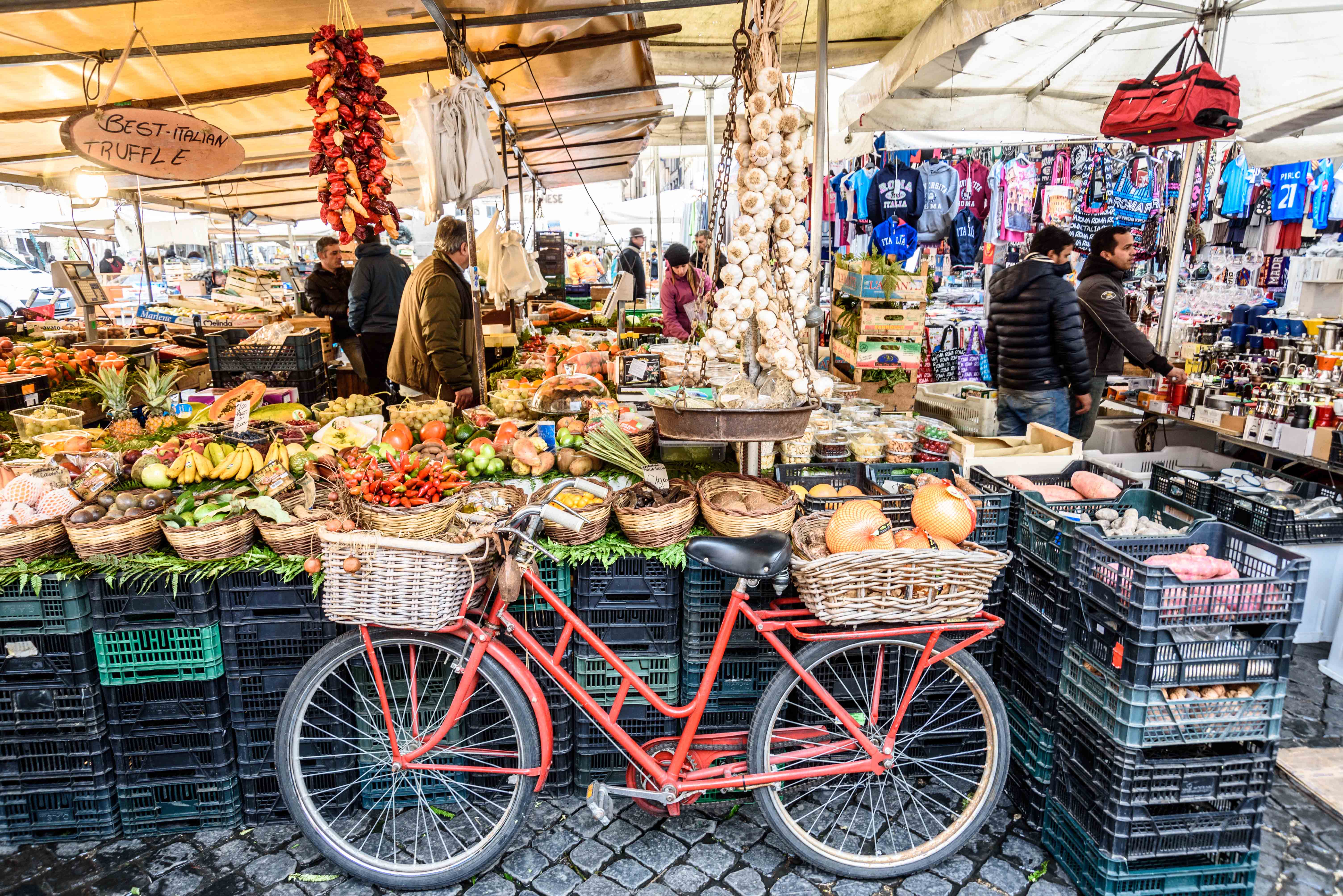 Campo de’ Fiori market stalls with fresh produce in Rome, ideal for family exploration.