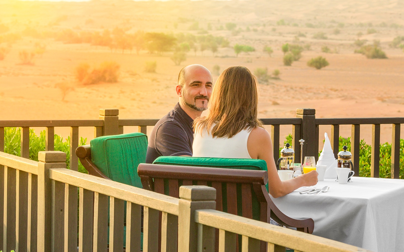 Safari vehicle driving through Dubai Desert Conservation Reserve.