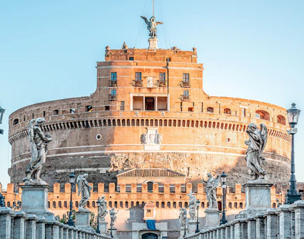 Castel Sant'Angelo in Rome with angel statues on Ponte Sant'Angelo.