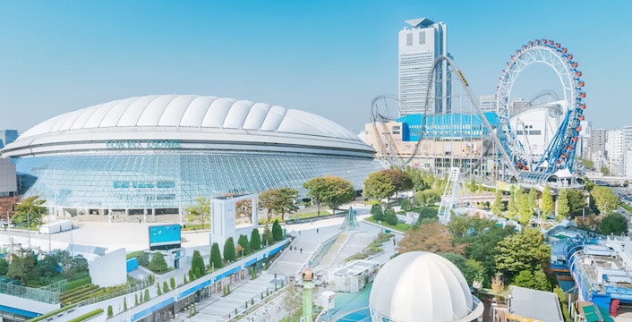 Tokyo Dome City Space Museum TenQ entrance with visitors exploring exhibits.