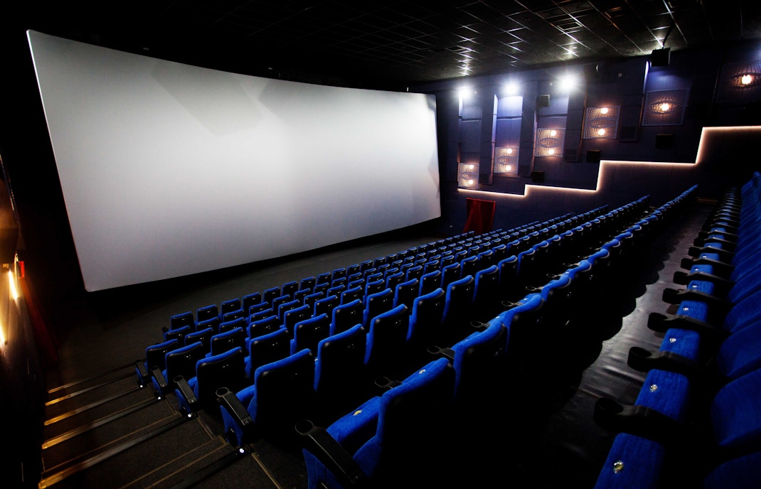 Visitors watching a space-themed film