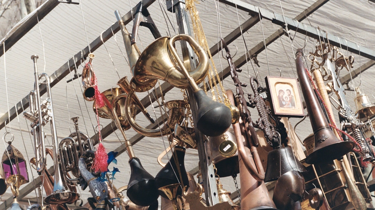 Vintage brass instruments and trinkets at El Rastro market, Madrid.