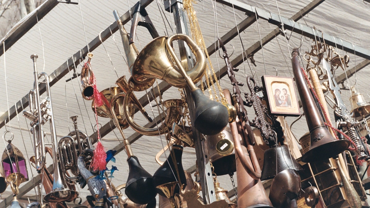 Vintage brass instruments and trinkets at El Rastro market, Madrid.