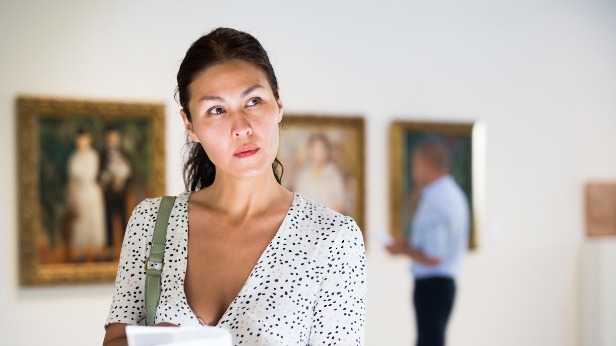 Visitor exploring Picasso Museum exhibition with skip-the-line tickets.