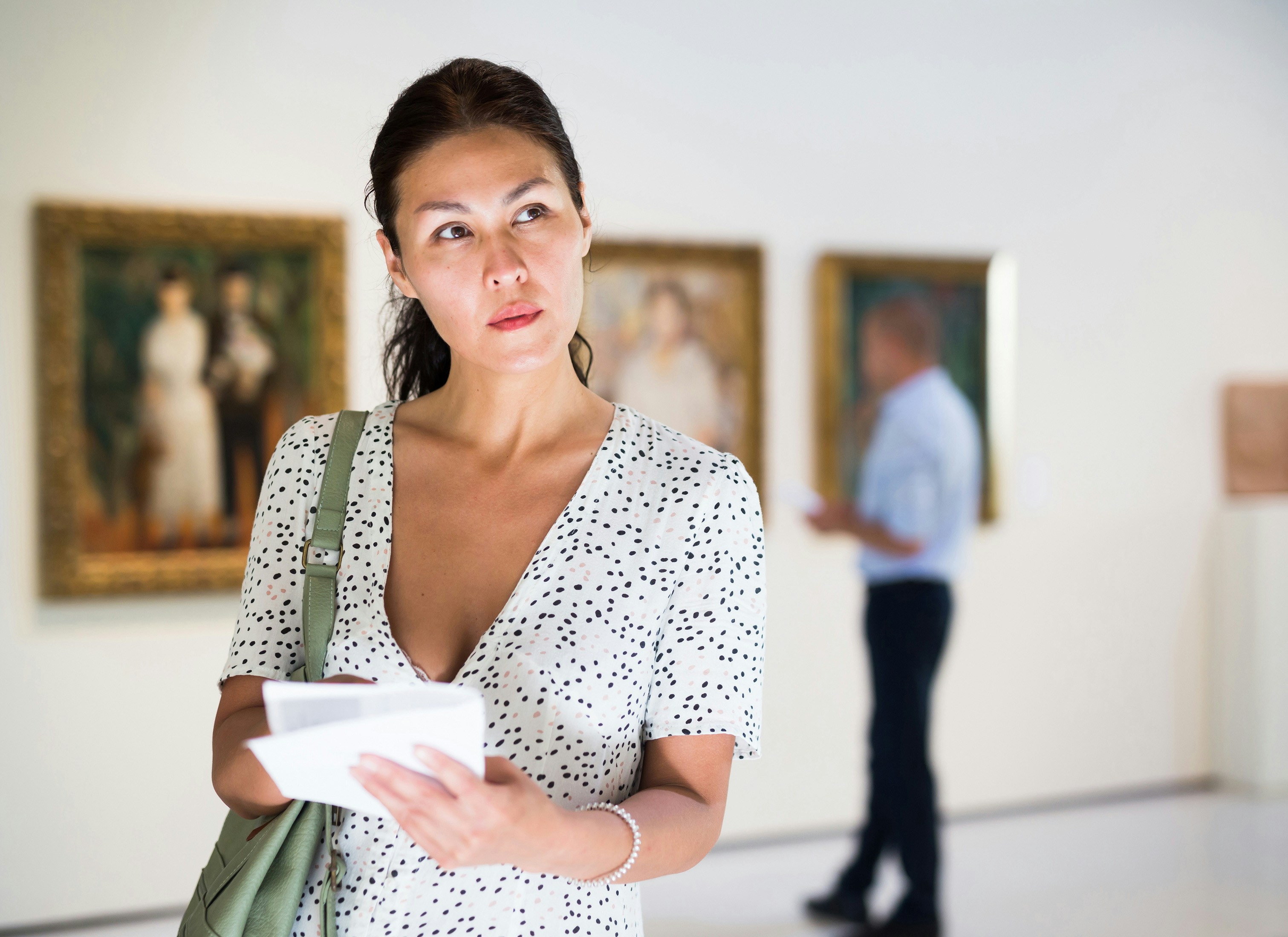 Visitor exploring Picasso Museum exhibition with skip-the-line tickets.