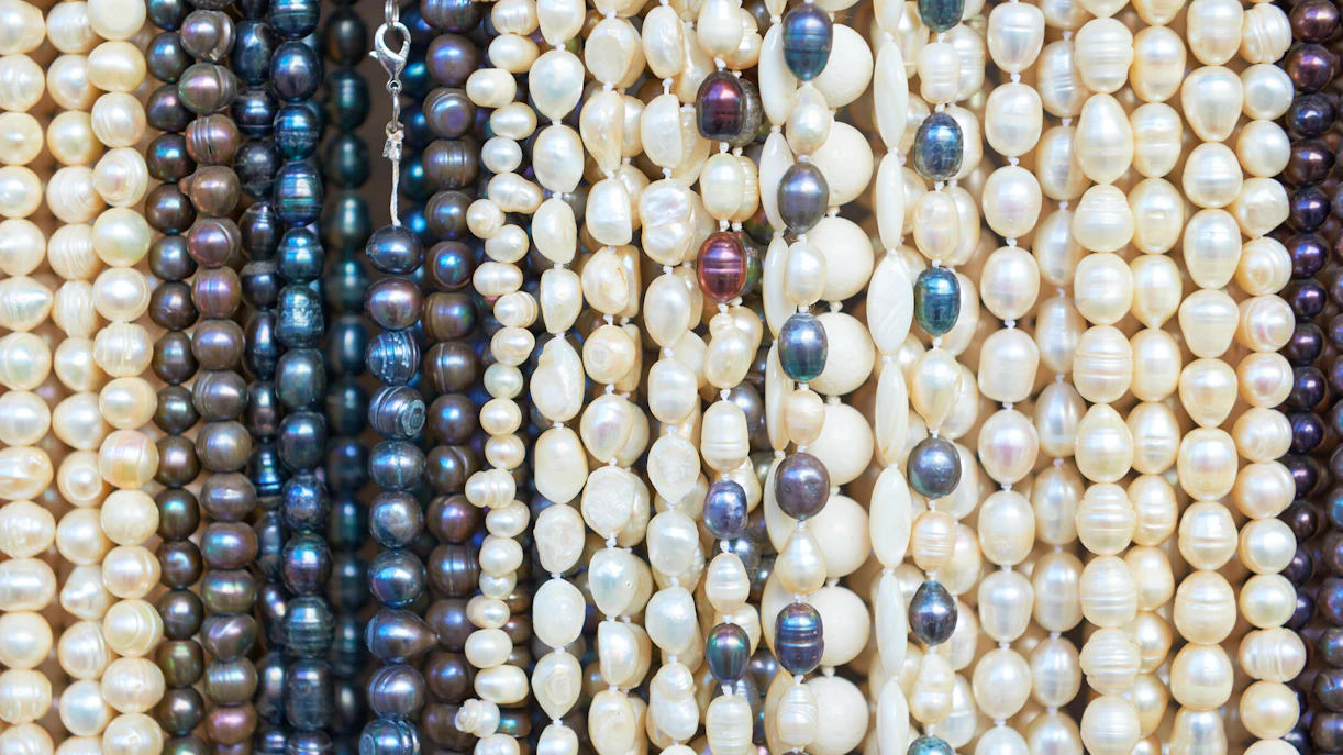 Pearl necklaces displayed as popular souvenirs in Dubai.