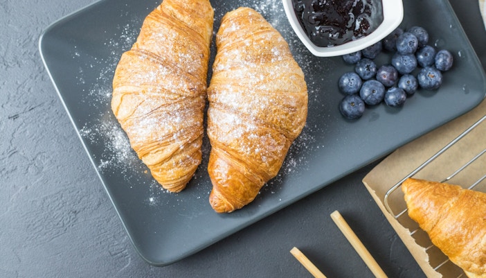 Croissant served with blueberries