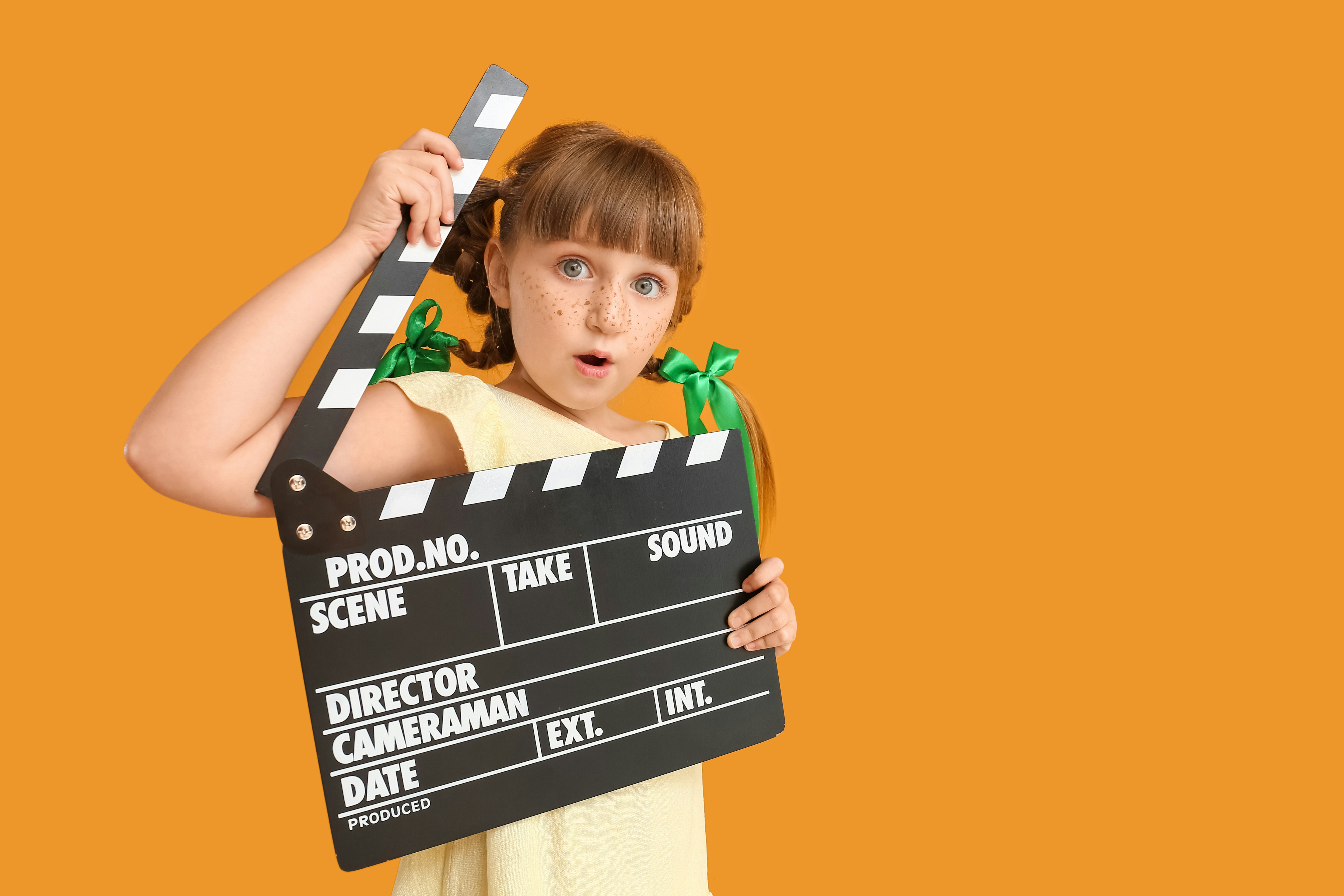 child role playing as filmmaker at kidzania dubai