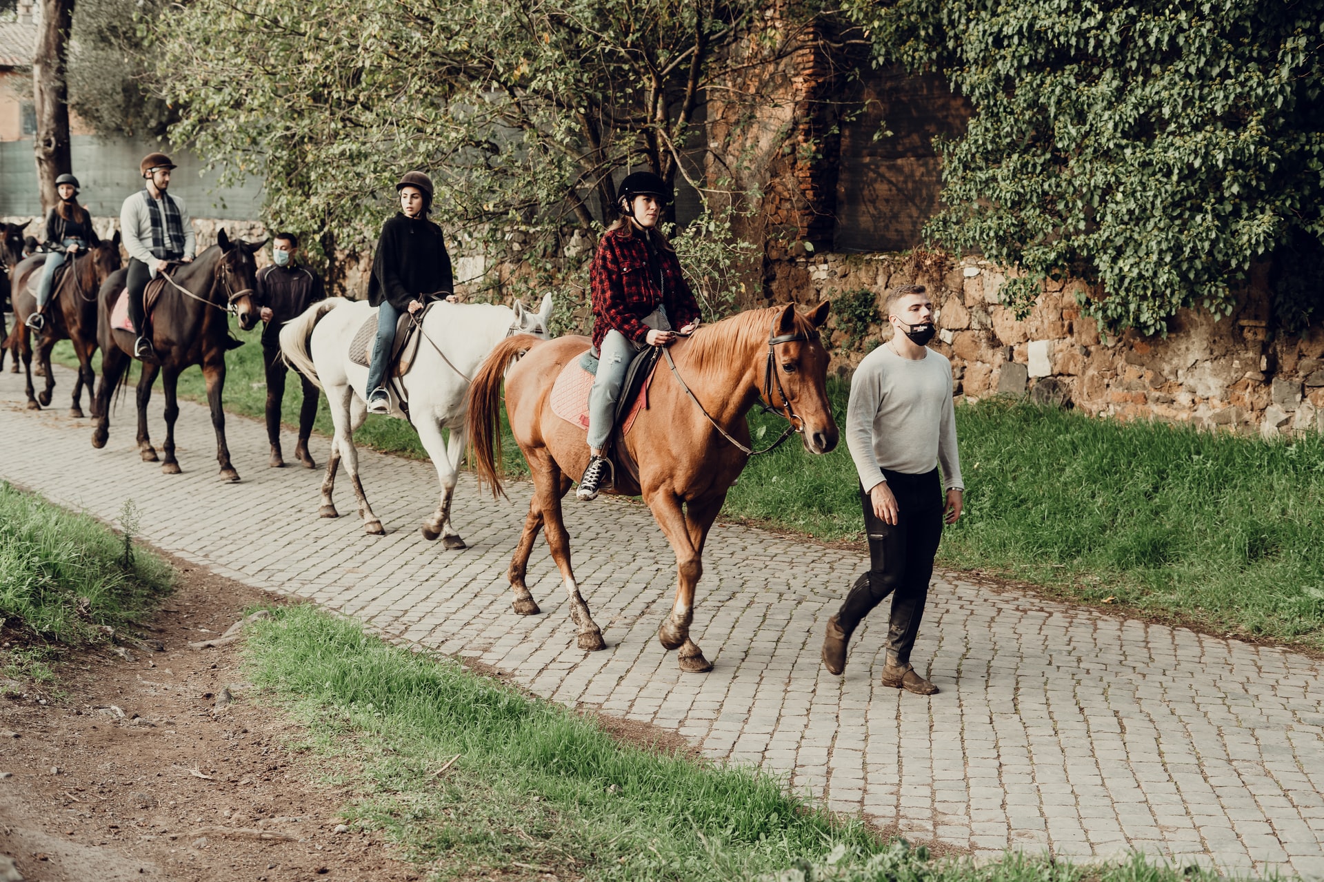 Horse-drawn carriage parade during Festa del Tres Tombs in Barcelona, Spain.