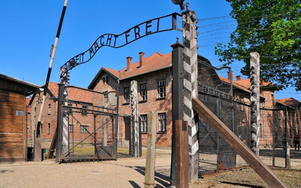 Entrance gate of Auschwitz I concentration camp with "Arbeit Macht Frei" sign.