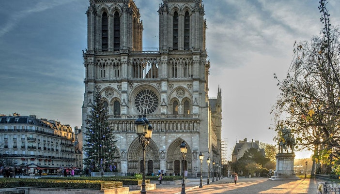 Notre Dame Cathedral in Paris with intricate Gothic architecture and iconic twin towers.