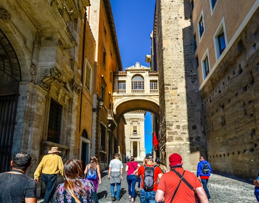 Visitors walking towards Palazzo Vecchio in Florence, Italy.