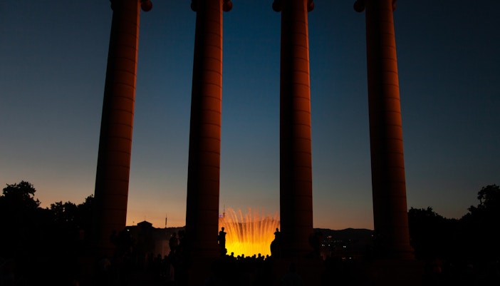 Magical Fountain Barcelona illuminated at night with colorful water display.