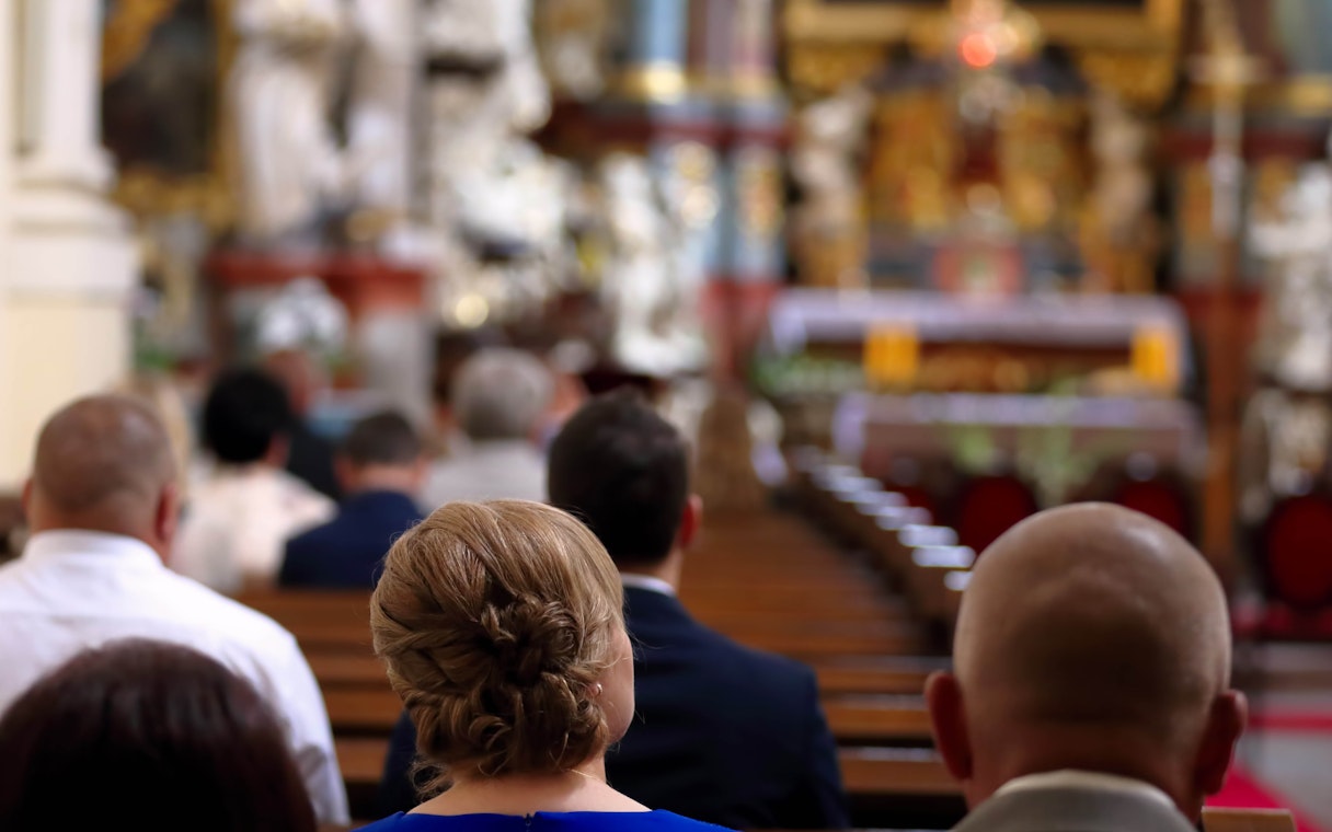 People attending mass at Sagrada Familia, Barcelona.