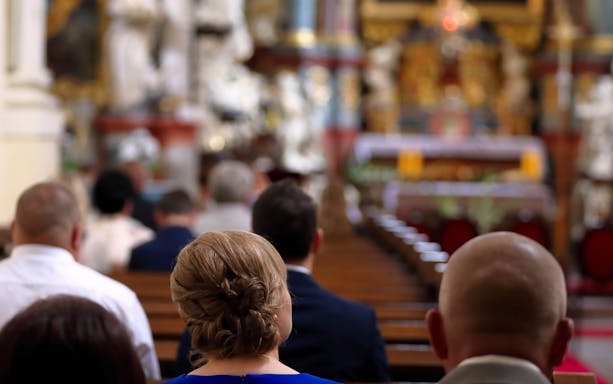 People attending mass at Sagrada Familia, Barcelona.