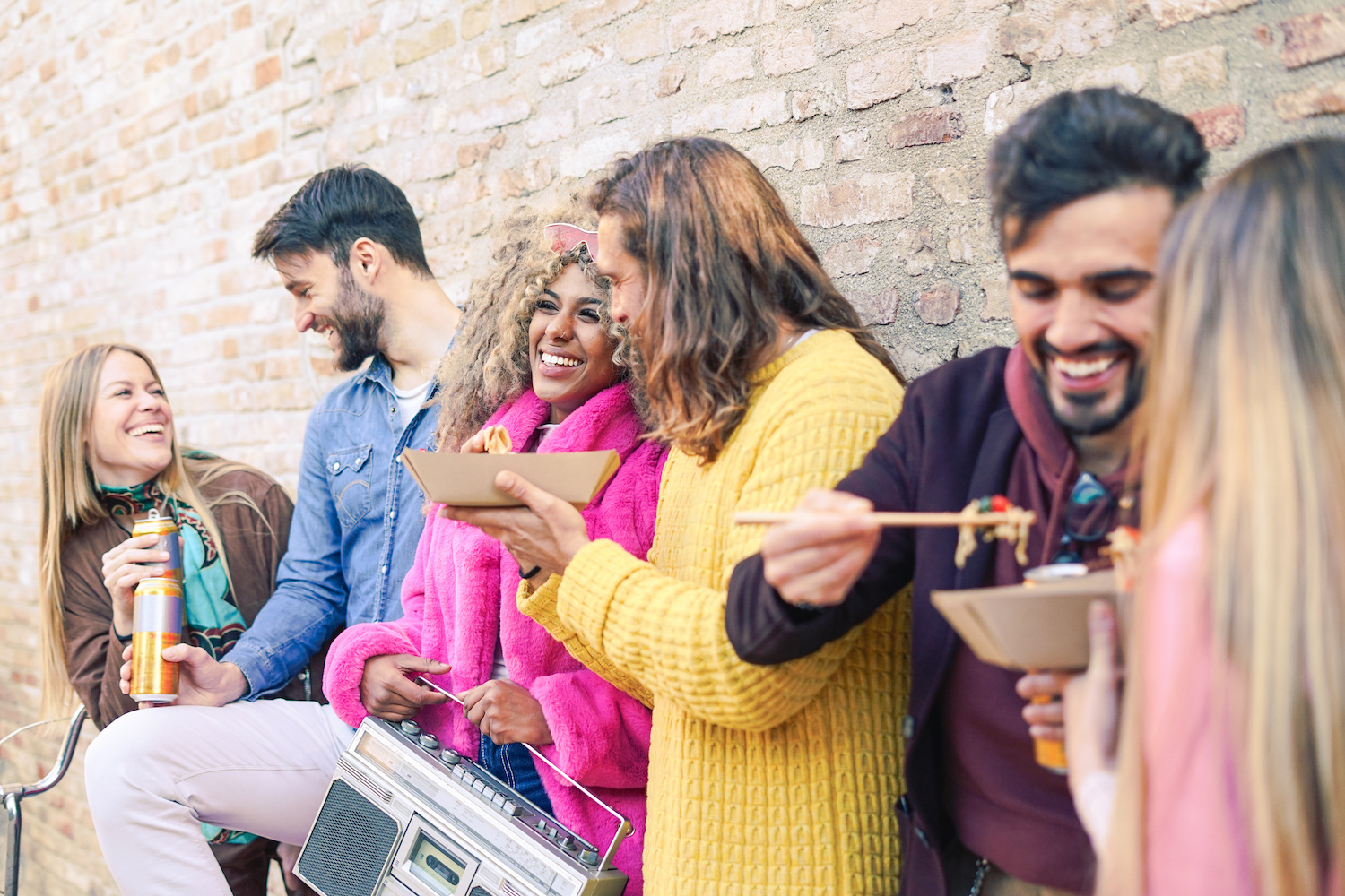 Group enjoying food at London Street Food Union market.