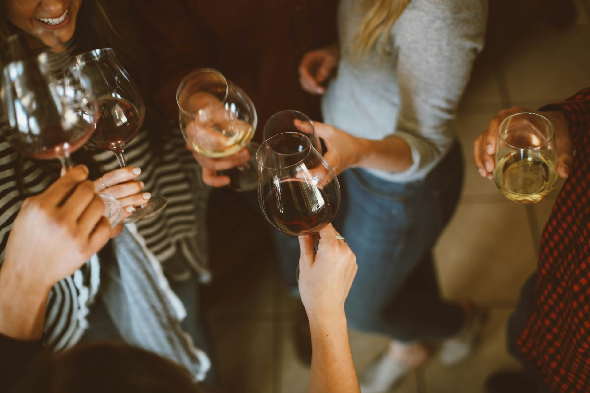 Group toasting with champagne glasses at a London New Year's Eve celebration.