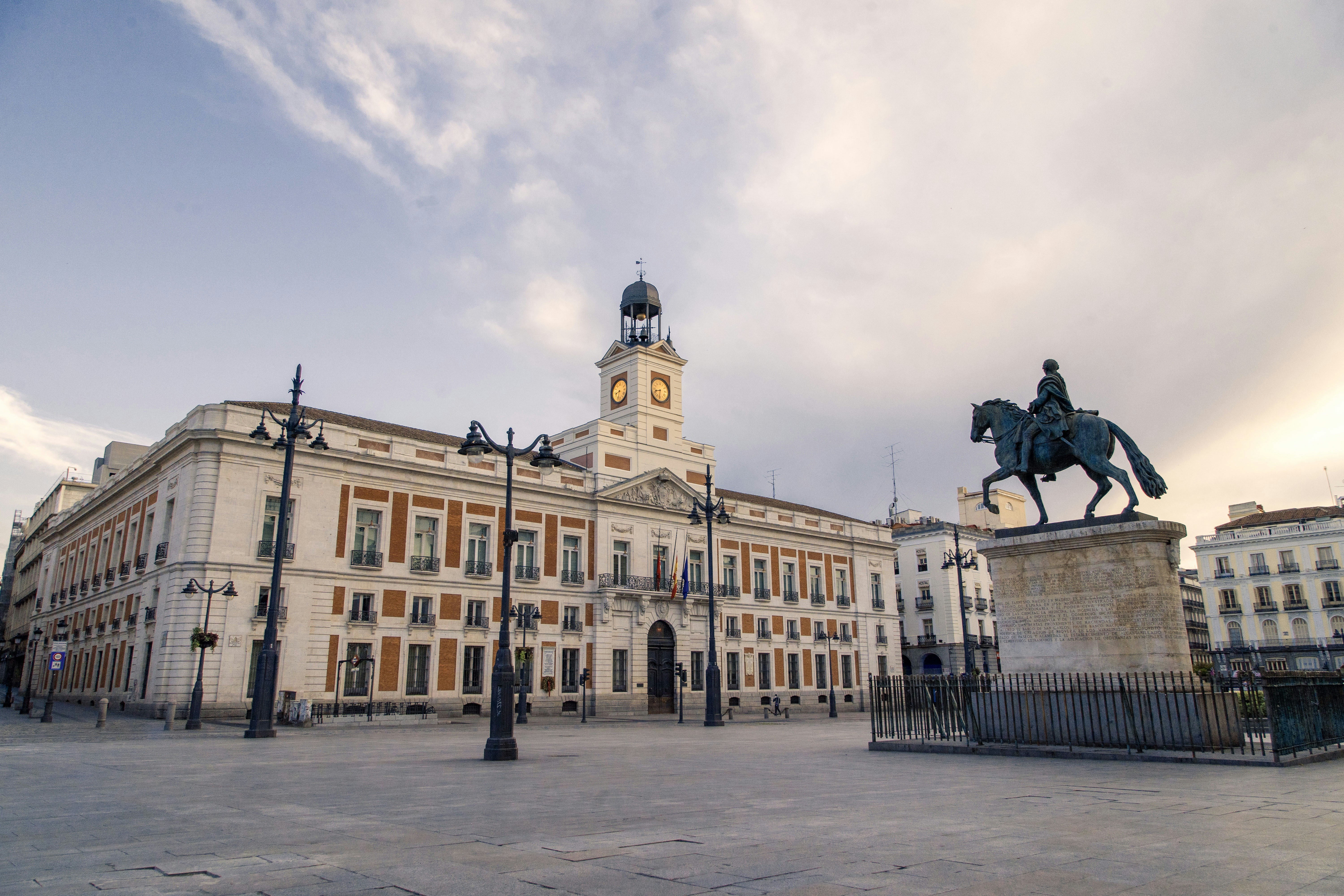 Equestrian statue and clock tower at Puerta del Sol, Madrid.