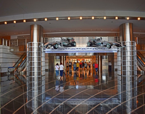 KL Mall Genting entrance with shoppers and vibrant storefronts in Kuala Lumpur, Malaysia.
