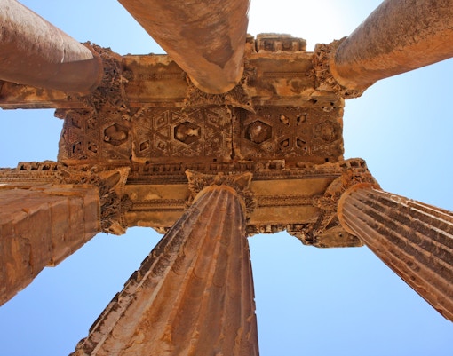 Temple of Poseidon pillars at Cape Sounion, Greece, overlooking the Aegean Sea.