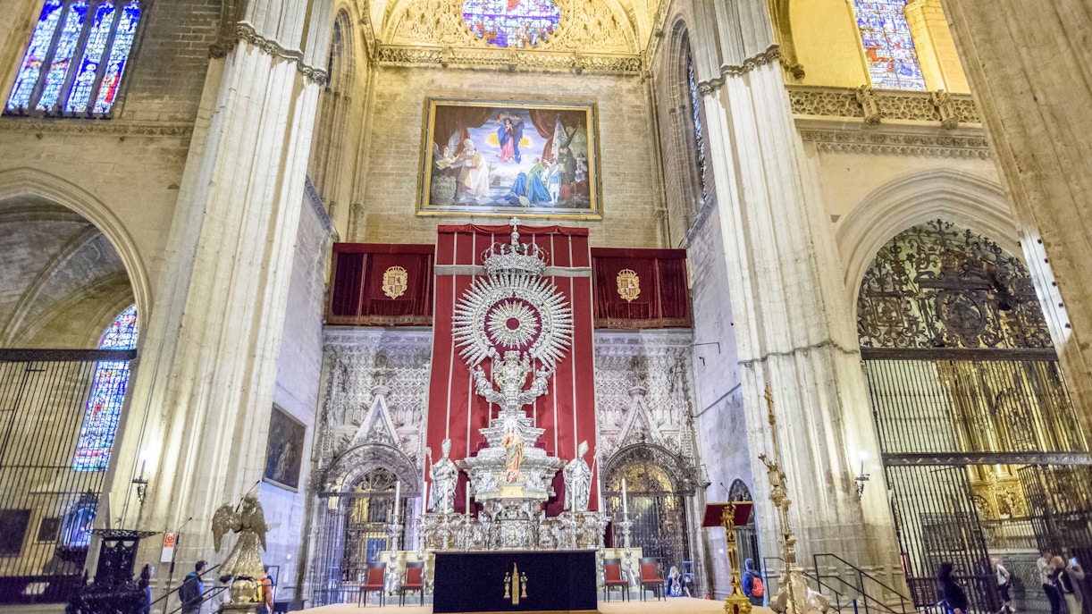 Seville Cathedral's Tabernacle interior with ornate altar and religious artifacts.