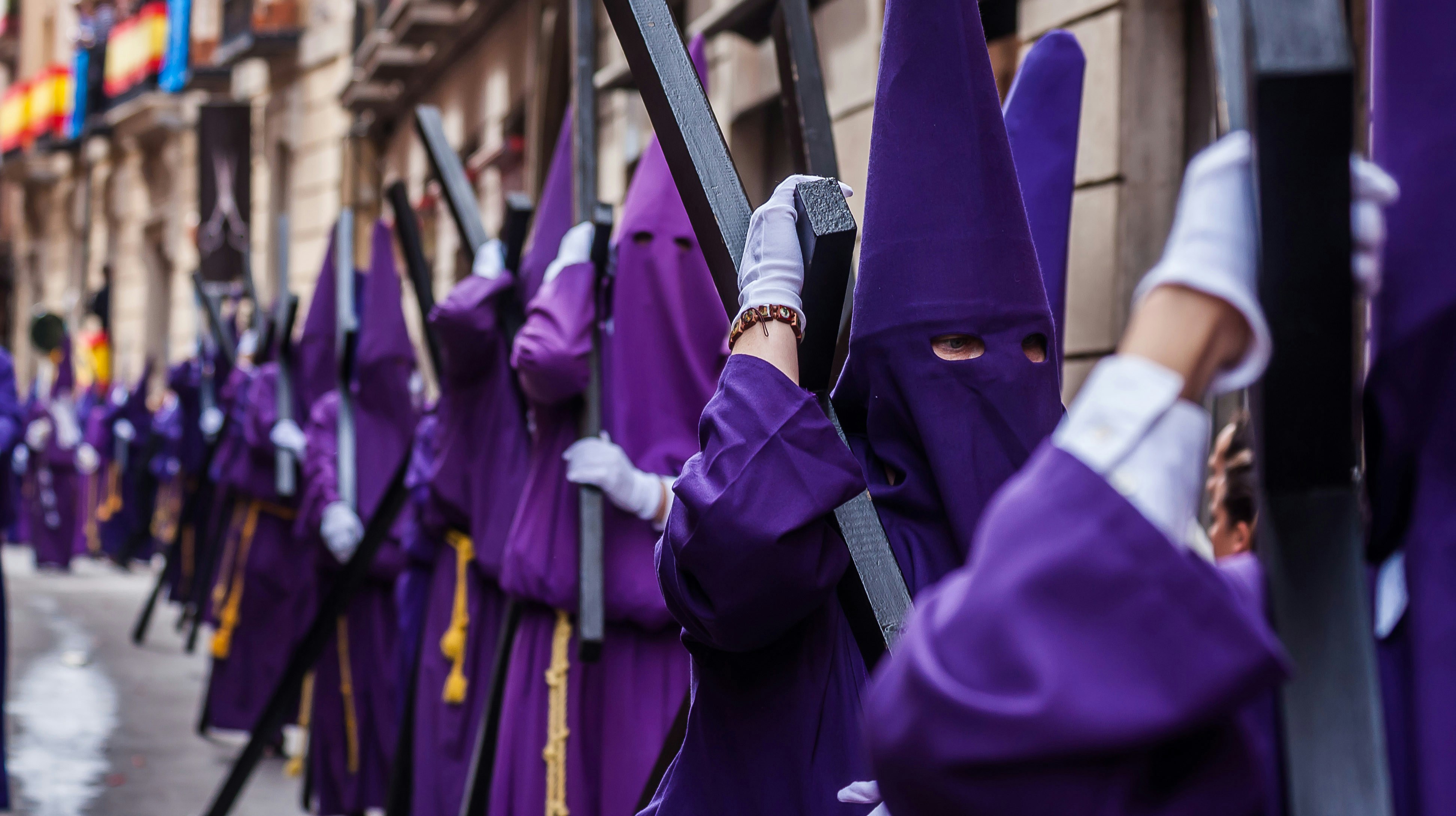 Participants in purple robes during Semana Santa procession, Madrid, April.