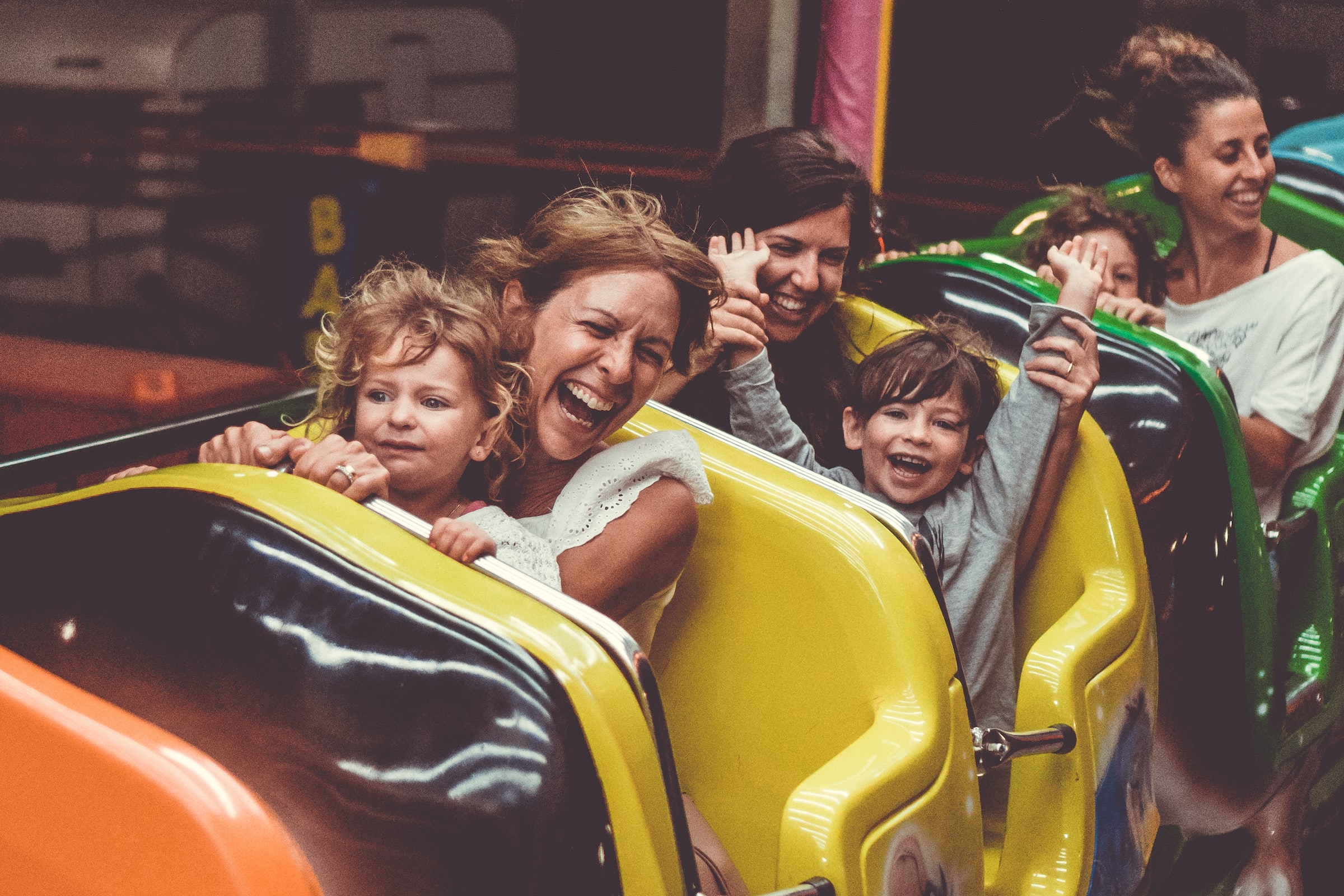 Families enjoying a ride at Babylon Park Camden, London.