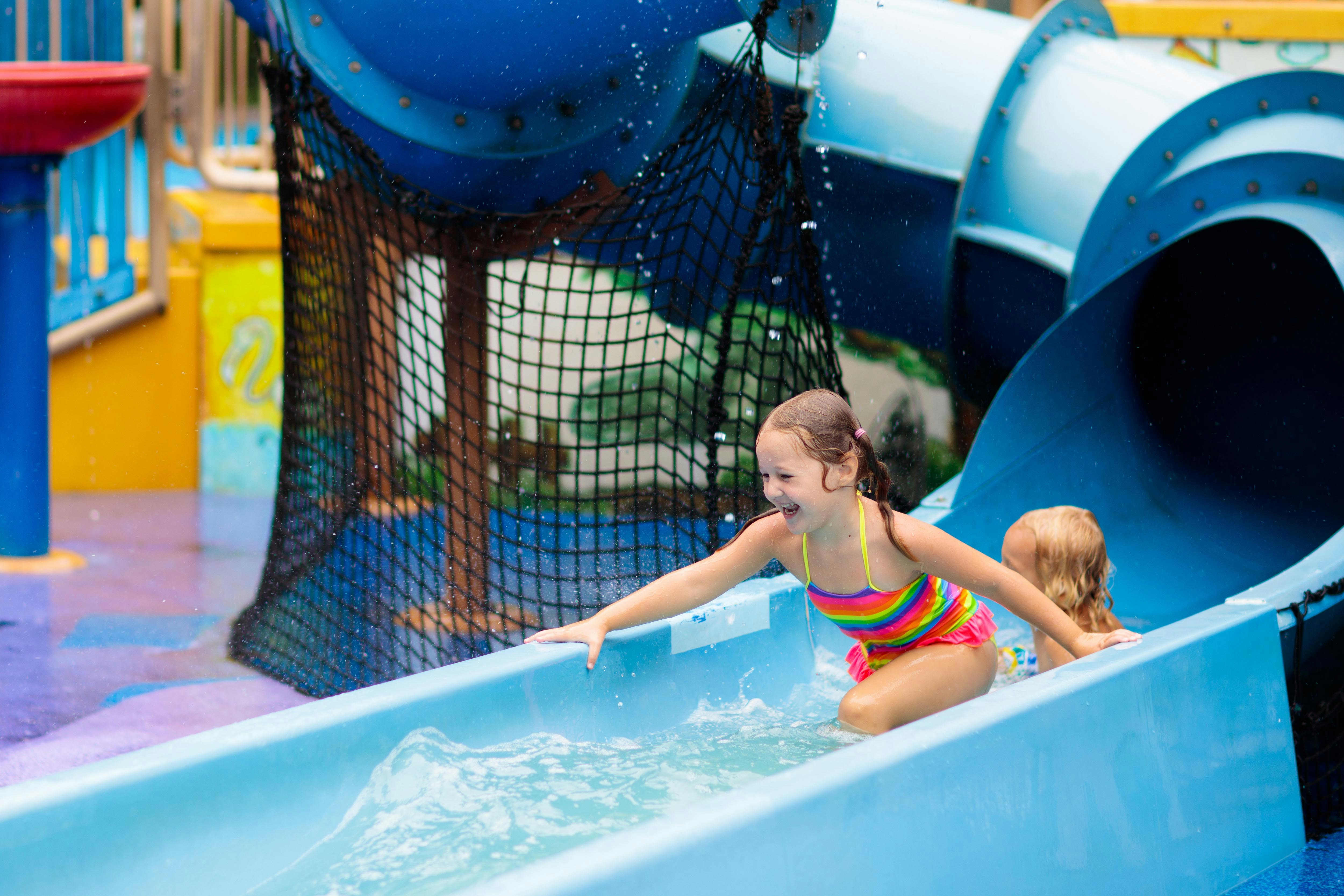 Kids playing o slides inside Goracy Potok Thermal Bath 