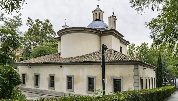 Ermita de San Antonio de la Florida in Madrid surrounded by trees.