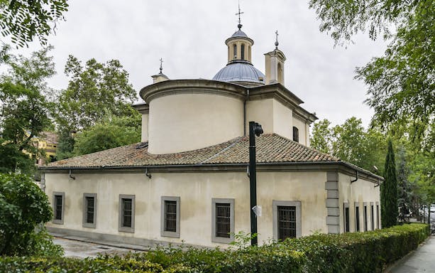 Ermita de San Antonio de la Florida in Madrid surrounded by trees.