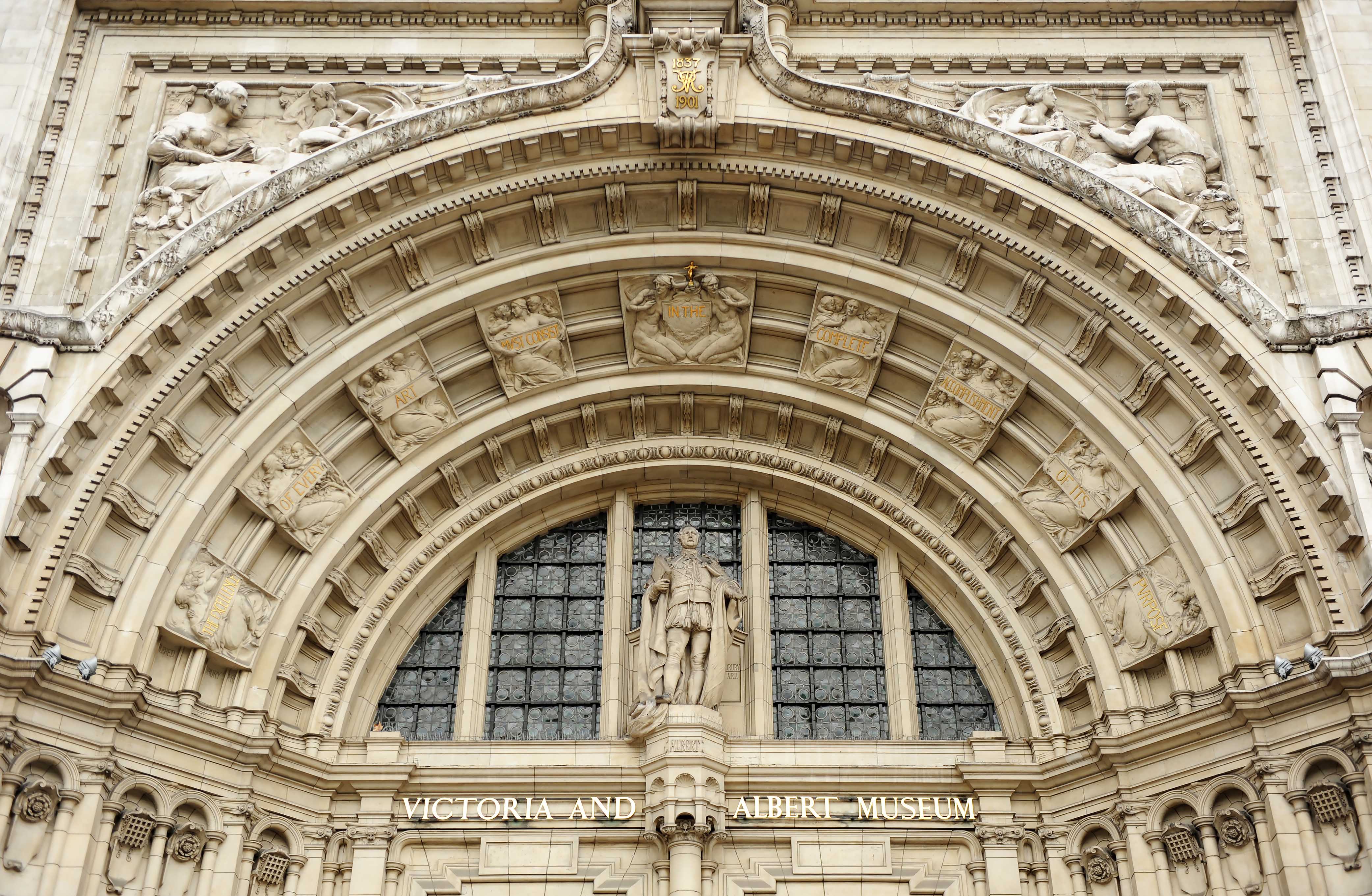 Victoria and Albert Museum entrance arch with detailed sculptures, London.