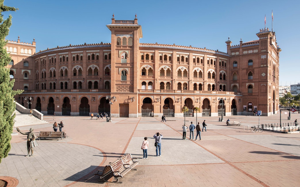 Las Ventas Bullring in Madrid with visitors in the plaza.