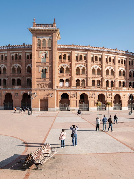 Las Ventas Bullring in Madrid with visitors in the plaza.
