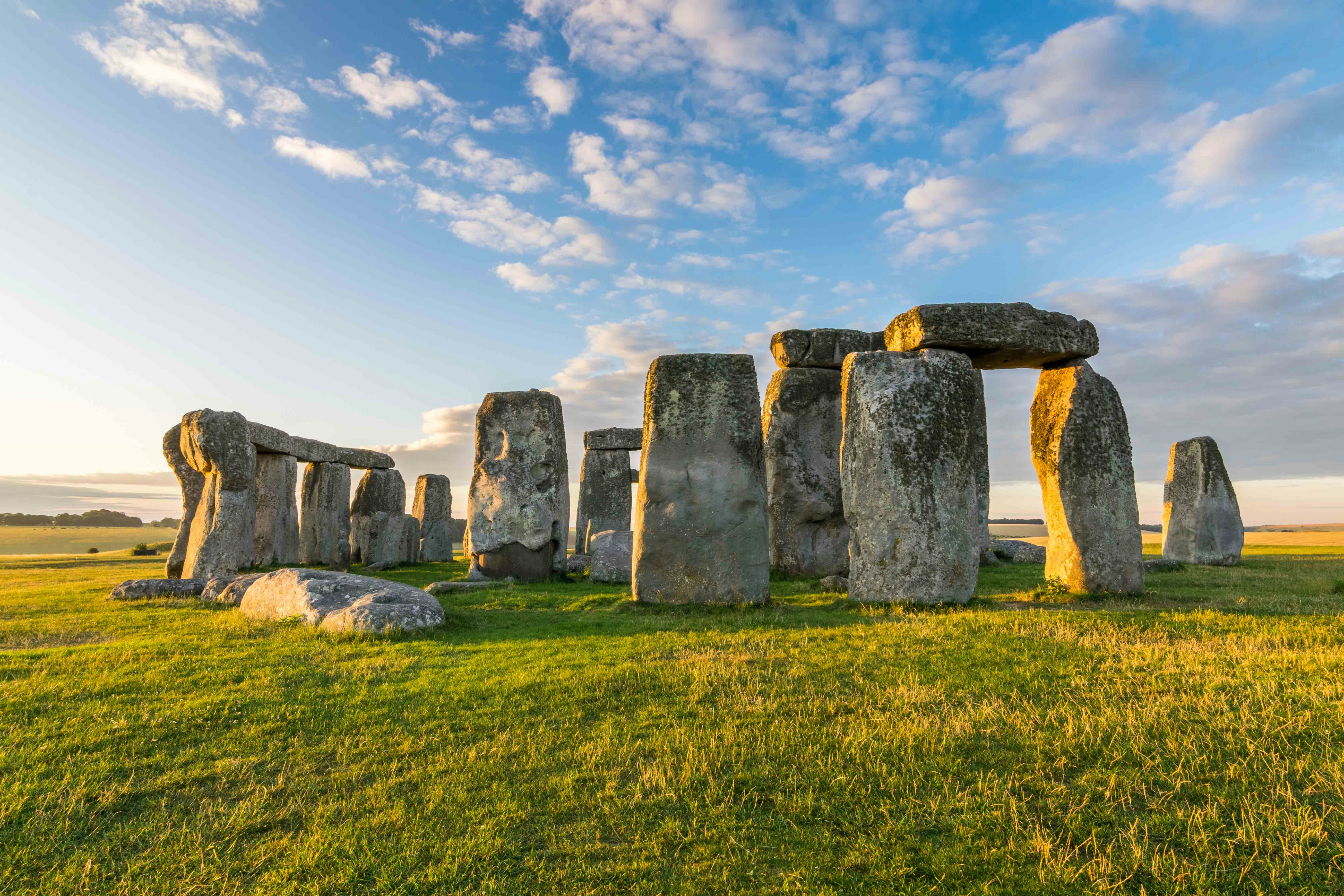 Stonehenge under a blue sky in Wiltshire, England.