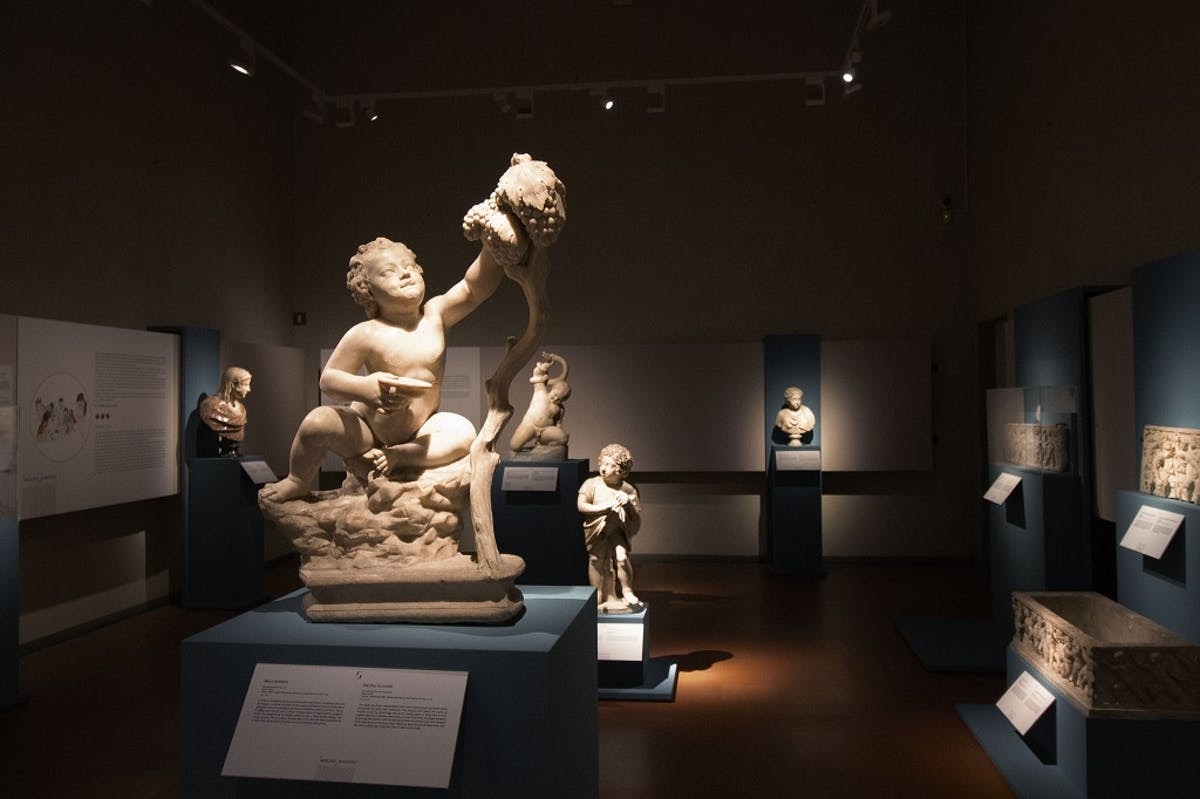 Visitors viewing art pieces at the Uffizi Exhibition in Florence, Italy.
