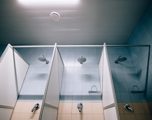 Showers and changing rooms at a beachside facility in Barcelona, Spain.