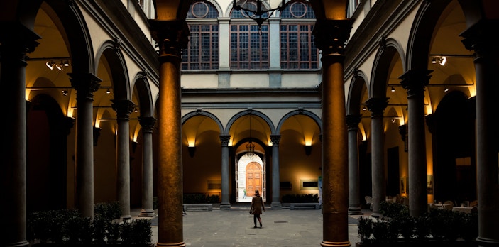 Strozzi Palace courtyard with arches and columns in Florence museum.