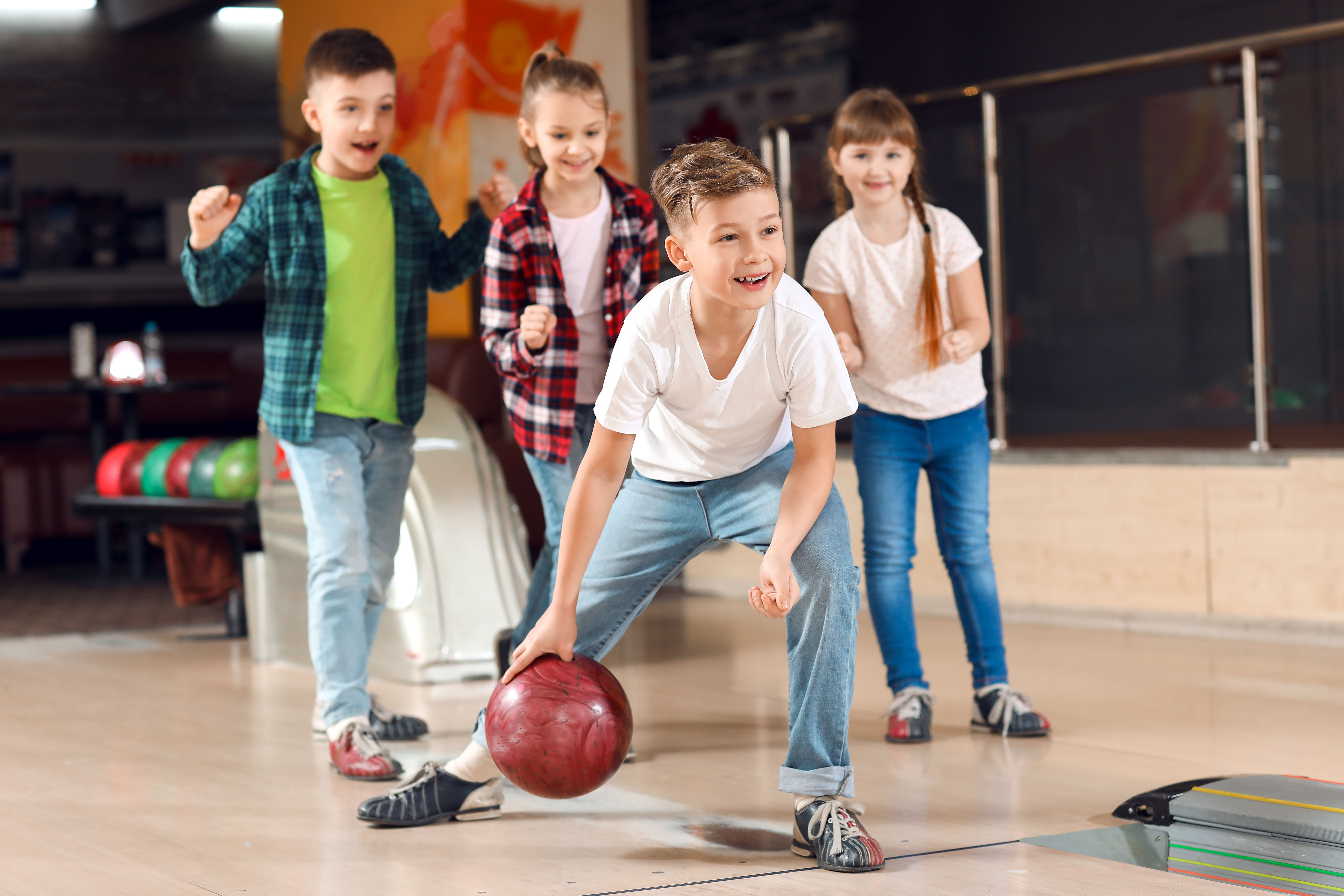 Children bowling at Cosmico Bowling during Rome to Tivoli day trip.