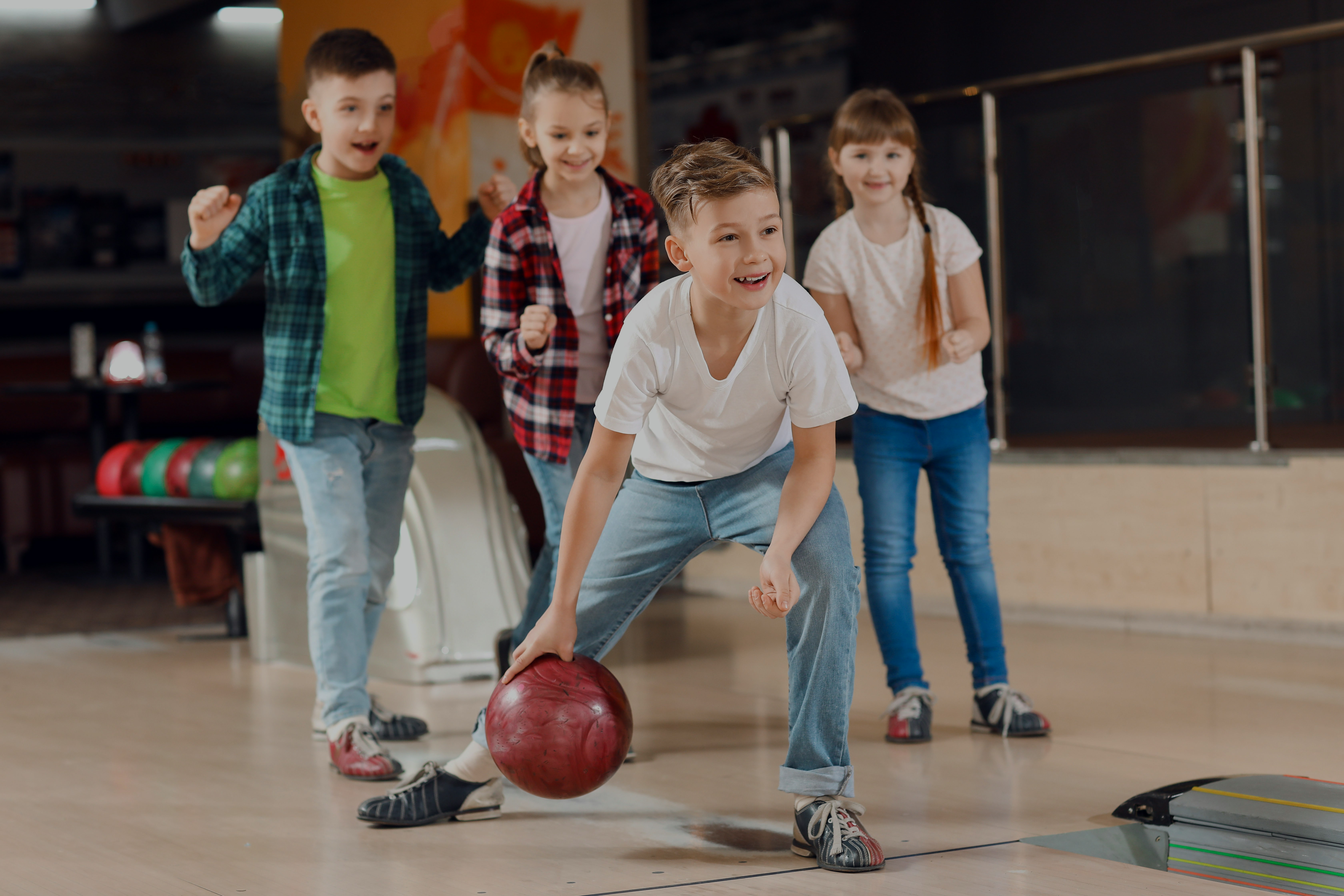 Children bowling at Cosmico Bowling during Rome to Tivoli day trip.