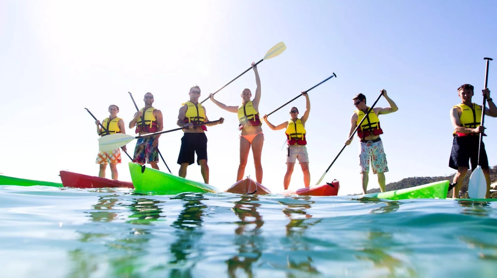 Group paddleboarding on Moreton Island tour.