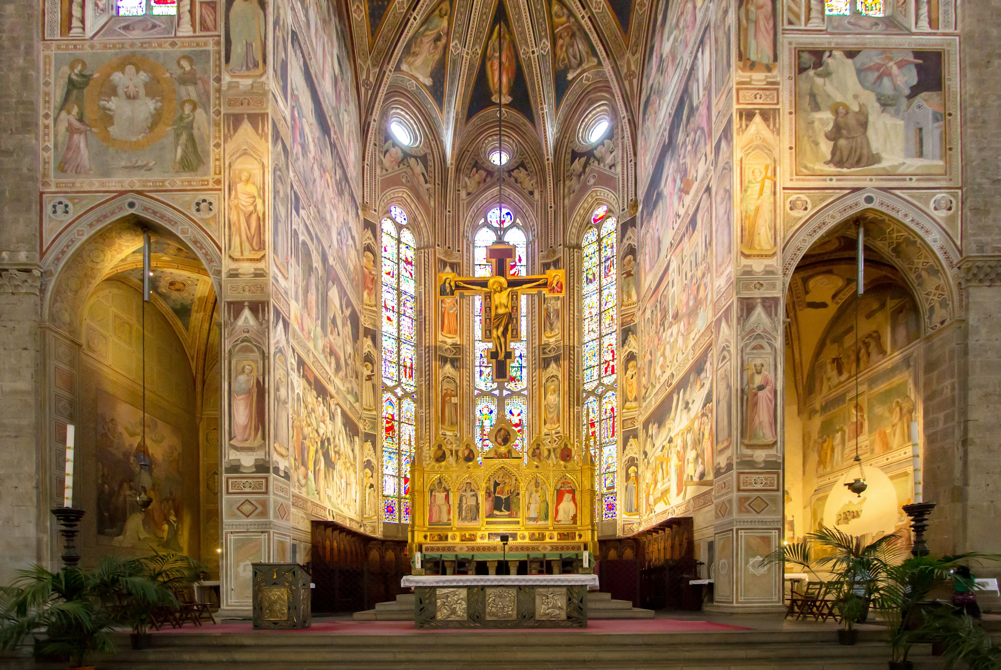 Basilica of Santa Croce interior with frescoes and stained glass, Florence.