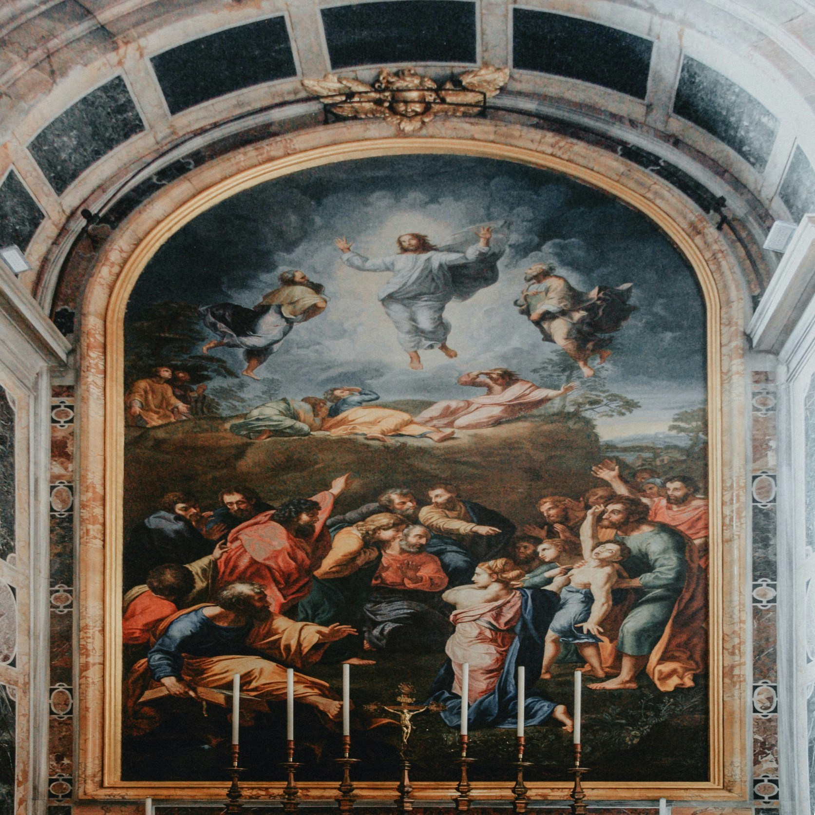 Painting of The Transfiguration inside Vatican Museum, depicting Christ and apostles.