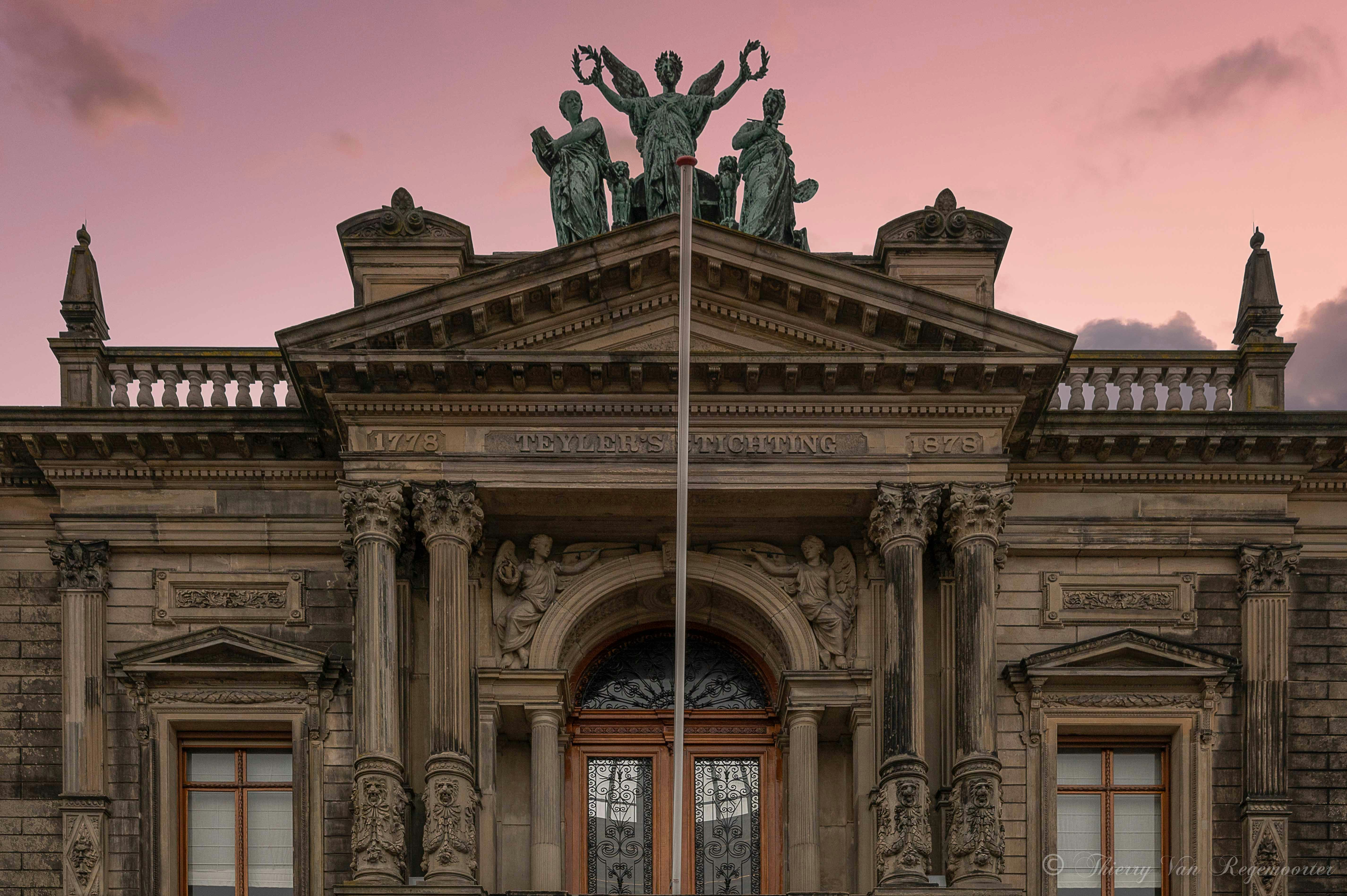 Teylers Museum facade with sculptures and columns, Haarlem, Netherlands.