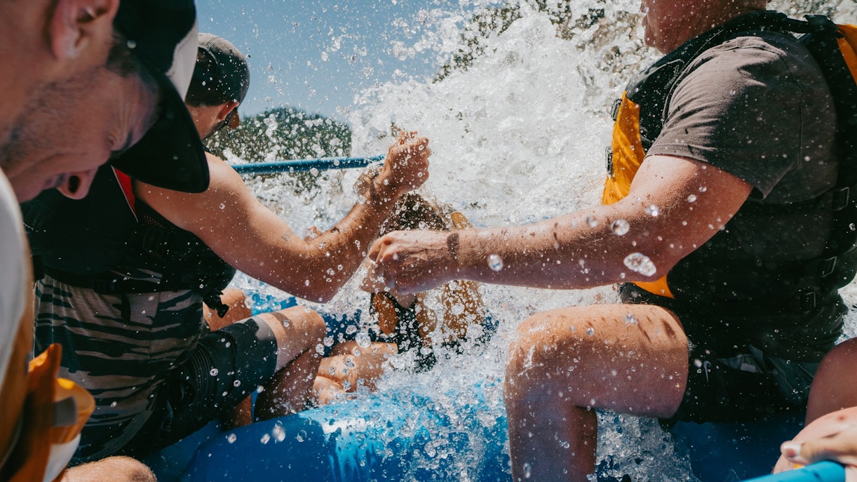 Wild Wadi Waterpark Dubai wave pool with visitors enjoying water slides and attractions.