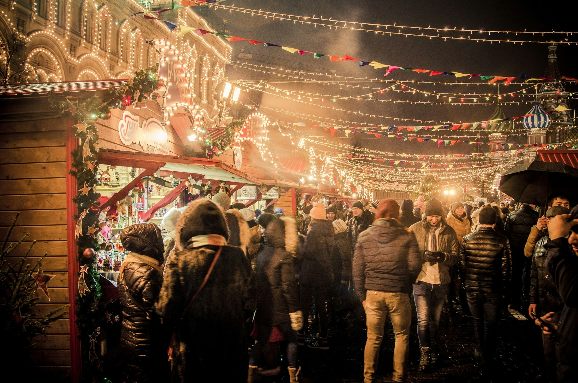 Barcelona Christmas market stalls with festive lights and decorations in December.
